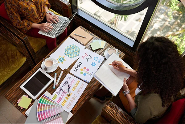 Female designers working on logo